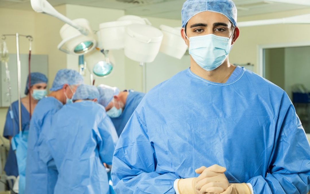 Appendectomy is surgery that treats appendicitis. This image is of surgeons in scrubs performing appendectomy.