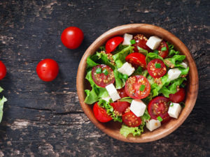A caprese salad with grape tomatoes, which also make GERD symptoms worse
