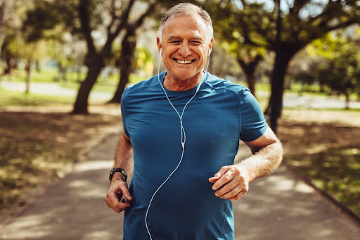 Older man jogging to prevent cancer with exercise