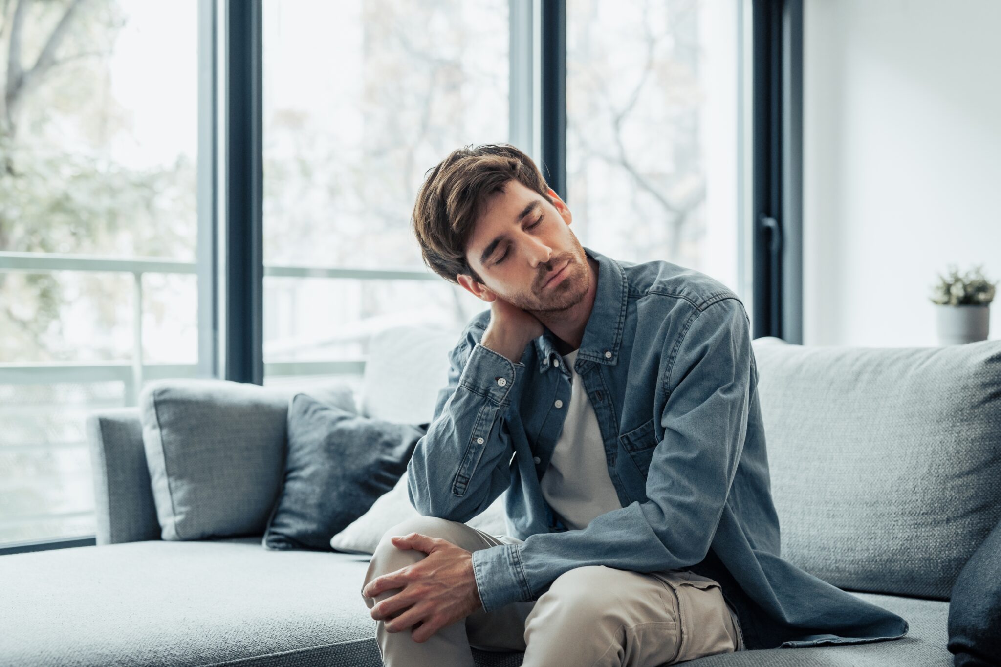 Young man with neck pain