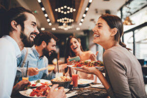 A group of friends enjoying a meal at a restaurant.