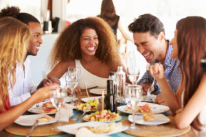 A group of friends enjoying a meal at a restaurant.