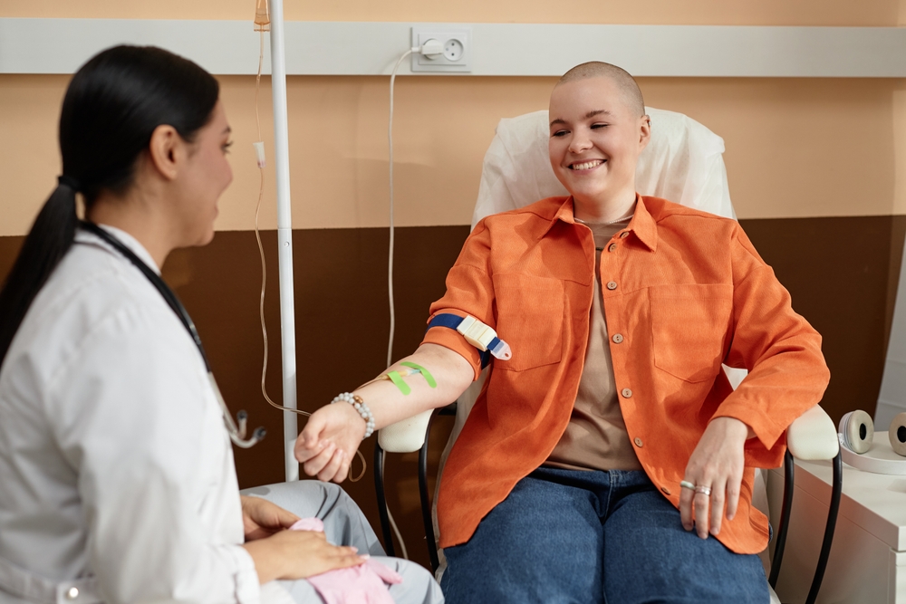 A cancer patient receiving chemotherapy with her doctor.