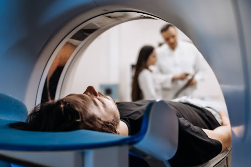 Man gets CT scan to help improve cancer diagnosis.